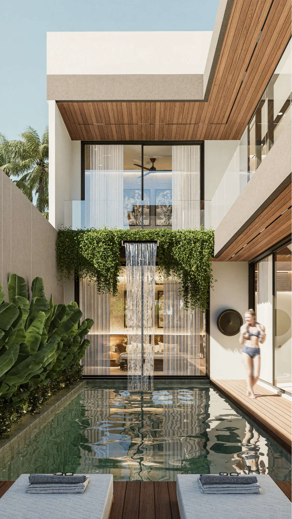 luxury villa pool with waterfall and loungers