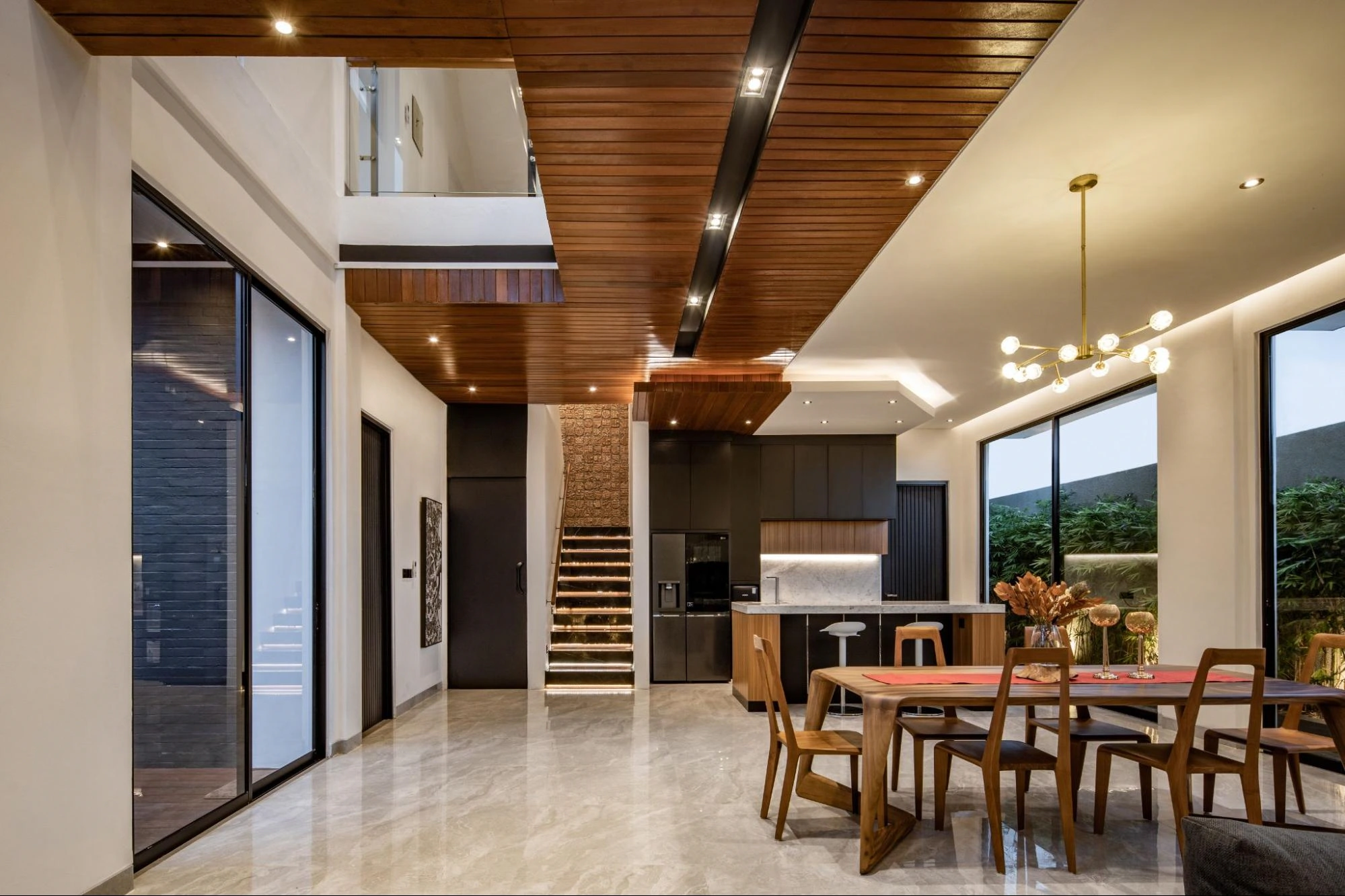 Luxurious modern interior with wood ceiling and stairs